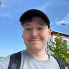 Smiling man looking towards camera