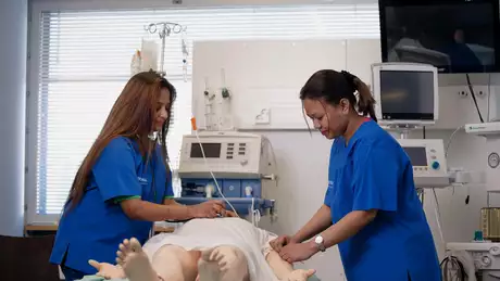 nurses with a simulation doll